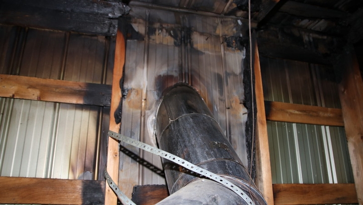 Fire resulting from a non-compliant wood heating system installation